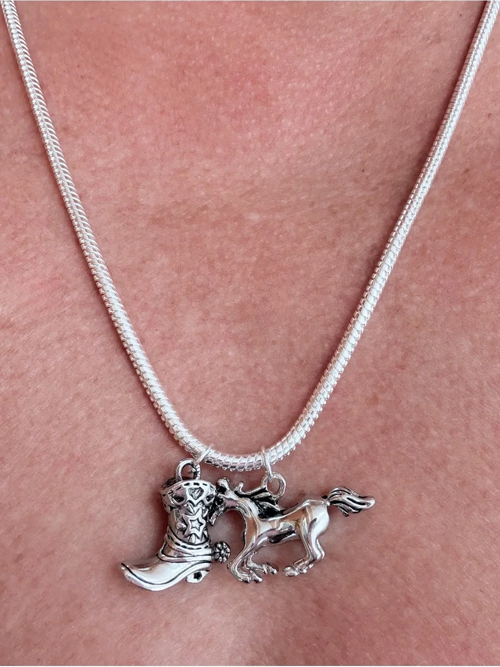 925 sterling silver necklace.23”snake chain,running horse & cowboy boot pendants